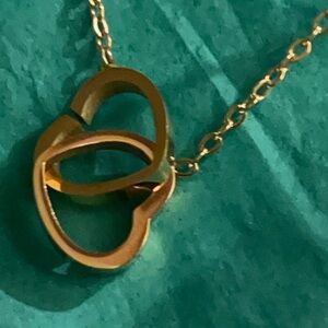 Elegant Gold-Tone Necklace 2 Hearts intertwined.